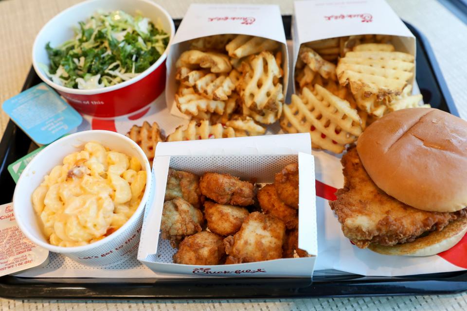 Chick Fil A serves fried chicken during their opening day at 2560 Kuebler Blvd. on Thursday, June 22, 2023 in Salem, Ore.