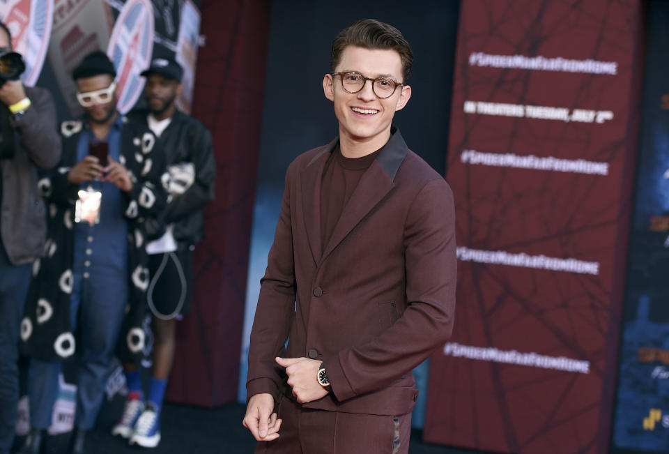 FILE - In this June 26, 2019 file photo, Tom Holland arrives at the world premiere of "Spider-Man: Far From Home" in Los Angeles. Hollywood studios are shuffling more release dates as a result of the coronavirus, including “Doctor Strange 2” and the sequels to “Spider-Man: Far From Home” and “Into the Spider-Verse.” Late Friday, both Sony Pictures and The Walt Disney Co. announced updated theatrical release schedules including some significant delays to some of their marquee superhero films. Sony's live-action Spider-Man has been pushed back to November 2021. (Photo by Jordan Strauss/Invision/AP, File)