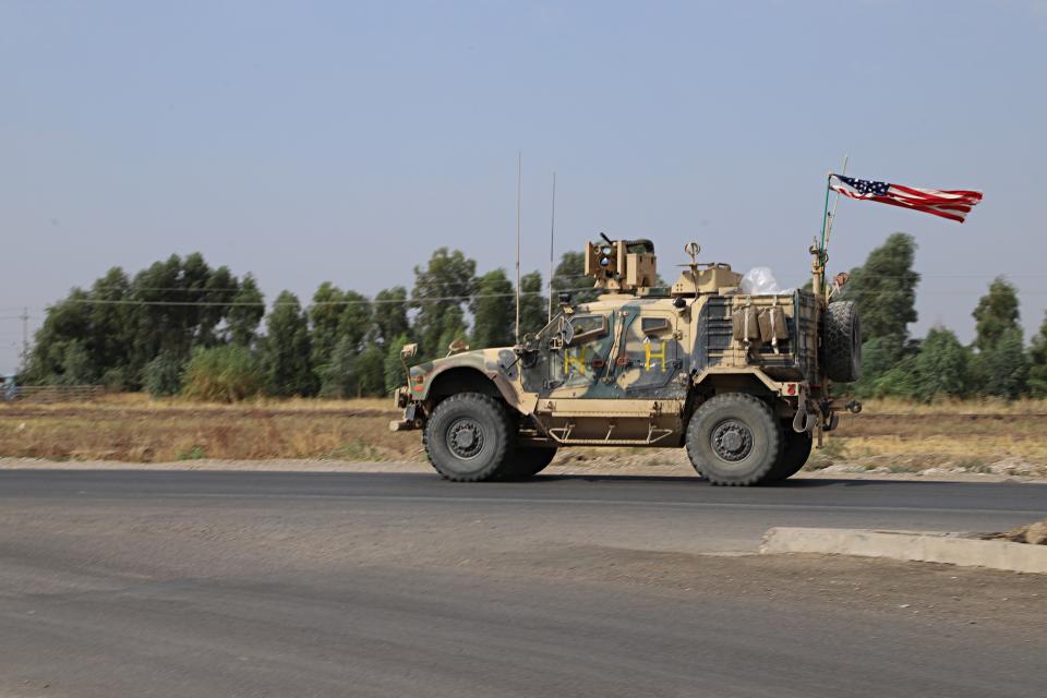 A U.S. military vehicle, part of a convoy, arrives near Dahuk, Iraqi, Monday, Oct. 21, 2019. Defense Secretary Mark Esper said Monday that under the current plan all U.S. troops leaving Syria will go to western Iraq and the military will continue to conduct operations against the Islamic State group to prevent its resurgence. (AP Photo)