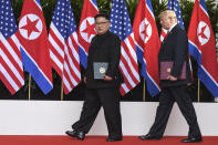 <p>North Korea leader Kim Jong Un and President Donald Trump walk with the documents they just signed at the Capella resort on Sentosa Island Tuesday, June 12, 2018 in Singapore. (Photo: Anthony Wallace, Pool via AP) </p>
