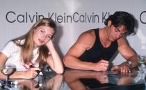 <p>Nearly 30 years ago, Kate Moss accomplished her first Calvin Klein campaign. The then-17-year-old posed fresh-faced in nothing but her Calvins, in a moody black-and-white campaign, showing major skin. Being Klein’s muse, the young model continued working with the designer and became the face of the Obsession fragrance campaign in 1993. Pictured, Kate and fashion model Michael Bergin attended an in-store appearance at Macy’s Calvin Klein boutique in New York (1994).</p>