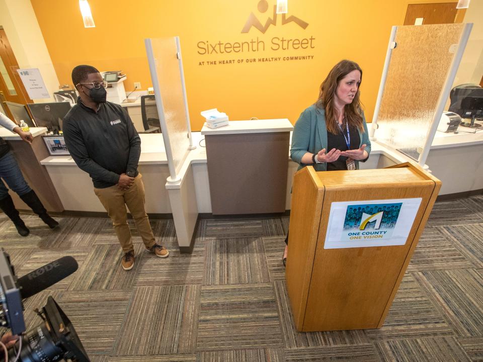 Andrea Nauer Waldschmidt, right, Psychiatric Crisis Service coordinator and co-chair of Prevent Suicide of Greater Milwaukee, speaks next to Milwaukee County Executive David Crowley, left, during a news conference on Wednesday, March 30, 2022, stressing the importance of community resources for suicide prevention at the Sixteenth Street Clinic in Milwaukee.