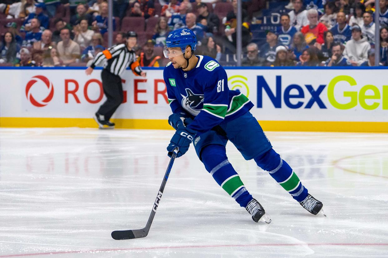 Canucks forward Dakota Joshua skates with the puck during a playoff game against the Oilers.