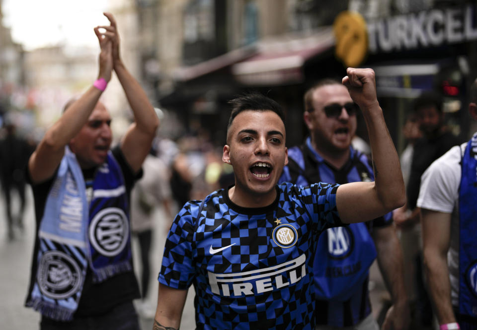 Supporters of Inter Milan chant slogans as they walk at Taksim square in Istanbul, Turkey, Friday, June 9, 2023. Manchester City will play Inter Milan in the final of the Champions League on Saturday June 10 in Istanbul.(AP Photo/Khalil Hamra)
