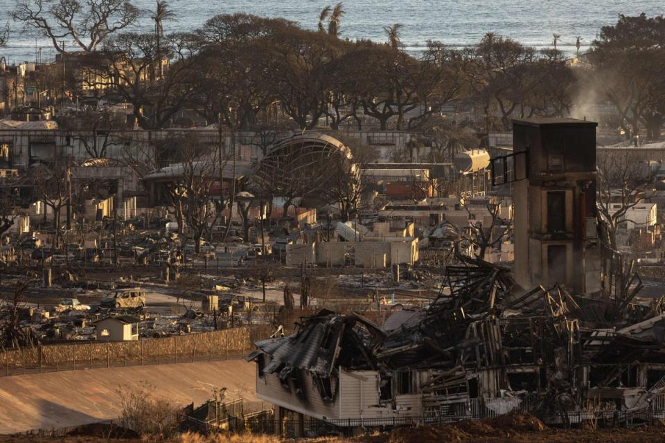 Burned houses and buildings are pictured in the aftermath of a wildfire, as seen in Lahaina, western Maui, Hawaii (AFP via Getty Images)