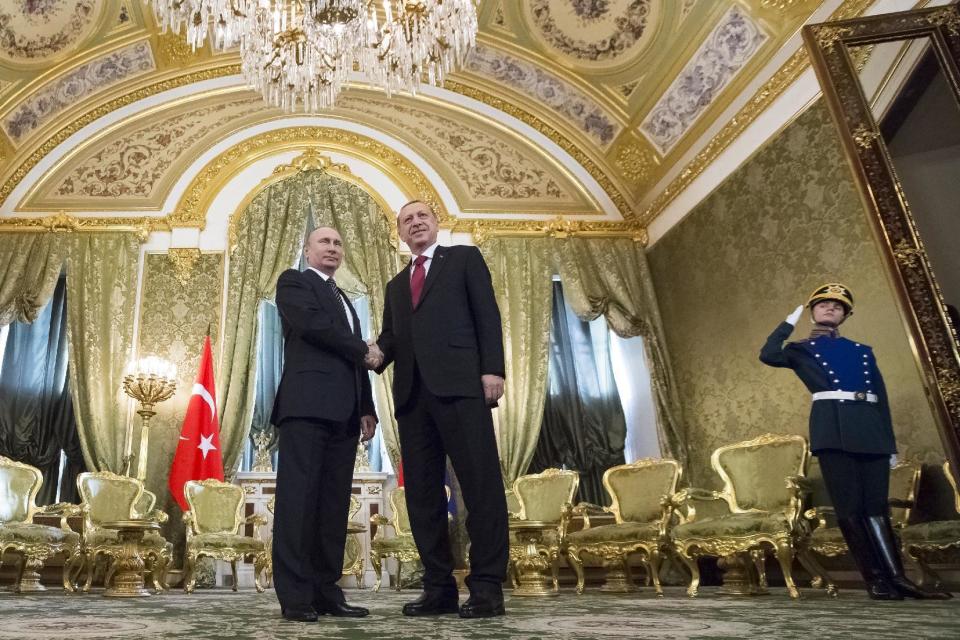 Russian President Vladimir Putin, left, shakes hands with Turkey's President Recep Tayyip Erdogan during their meeting in the Kremlin in Moscow, Russia, Friday, March 10, 2017. Putin is hosting his Turkish counterpart Recep Tayyip Erdogan for talks focusing on Syria, where Russia and Turkey have launched mediation efforts and coordinated military action. (AP Photo/Alexander Zemlianichenko, pool)
