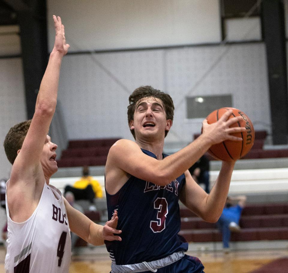 Lacey Troy Buxton drives in against Red Bank Tommy Keegan. Lacey Boys Basketball vs Red Bank in Albert E. Martin But Holiday Classic in Red Bank, NJ on December 28, 2021.