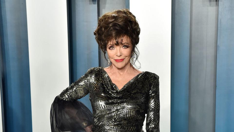 Joan Collins looking glam in black dress 