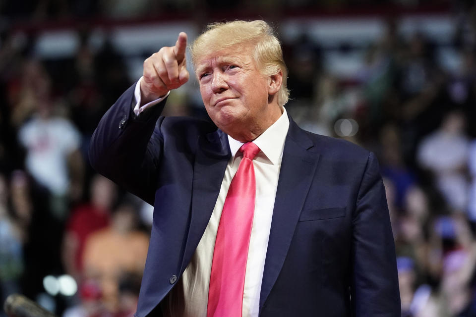 FILE - Former President Donald Trump points to the crowd as he arrives to speak at a rally July 22, 2022, in Prescott, Ariz. Trump is returning to Washington for the first time since leaving office to deliver a policy speech Tuesday night, July 26 before allies who have been crafting an agenda for a possible second term. Trump will address the America First Policy Institute's two-day America First Agenda Summit. (AP Photo/Ross D. Franklin, File)