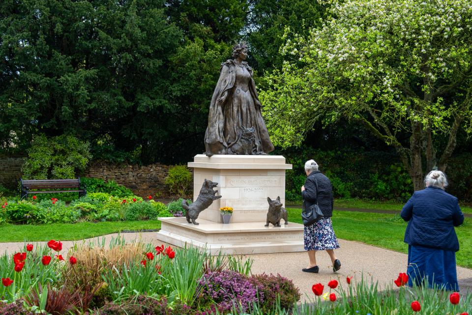 The bronze memorial also features a set of smaller corgi statues surrounding the queen, a tribute to Elizabeth’s lifelong love of the Welsh dog breed.