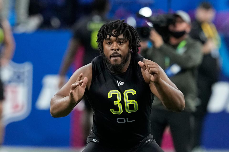 Memphis offensive lineman Dylan Parham runs a drill during the NFL football scouting combine, Friday, March 4, 2022, in Indianapolis. (AP Photo/Darron Cummings)