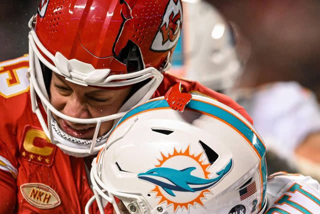 <p>Emily Curiel/The Kansas City Star/Tribune News Service via Getty</p> The helmet of Kansas City Chiefs quarterback Patrick Mahomes breaks while being hit by Miami Dolphins safety DeShon Elliott on a run in the third quarter of the AFC Wild Card game Saturday, Jan. 13, 2024