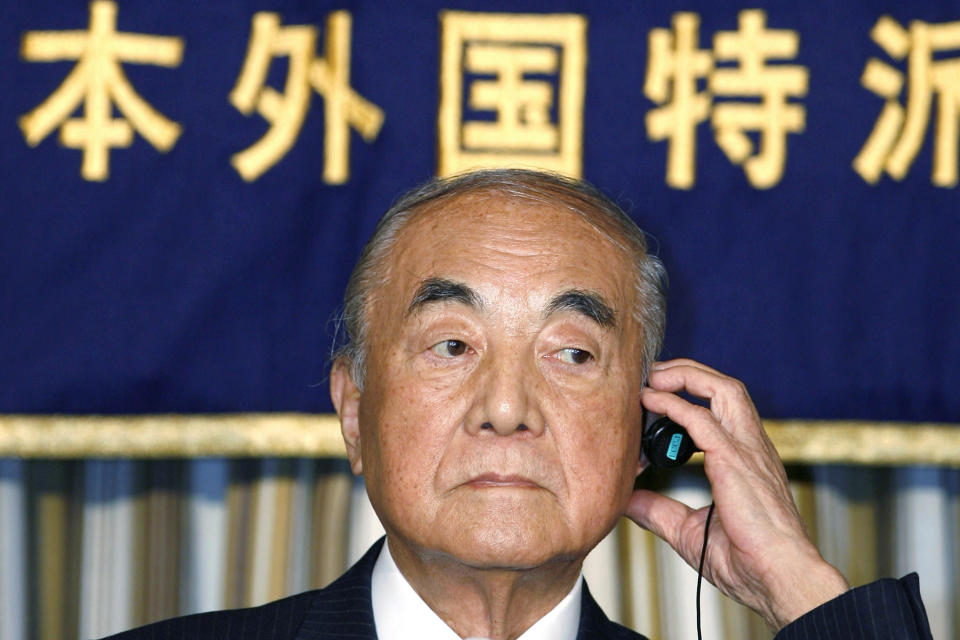 FILE - In this March 23, 2007, file photo, former Japanese Prime Minister Yasuhiro Nakasone adjusts earphone during a press conference in Tokyo. Nakasone, a giant of his country’s post-World War II politics, died on Friday, Nov. 29, 2019. He was 101. (AP Photo/Shuji Kajiyama, File)