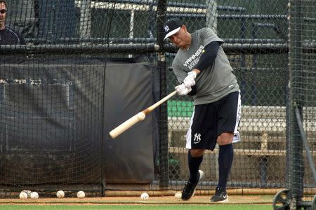 New York Yankees third baseman Alex Rodriguez (13) makes contact during batting practice of the afternoon workouts at New York Yankee Minor League Complex. Mandatory Credit: Tommy Gilligan-USA TODAY Sports