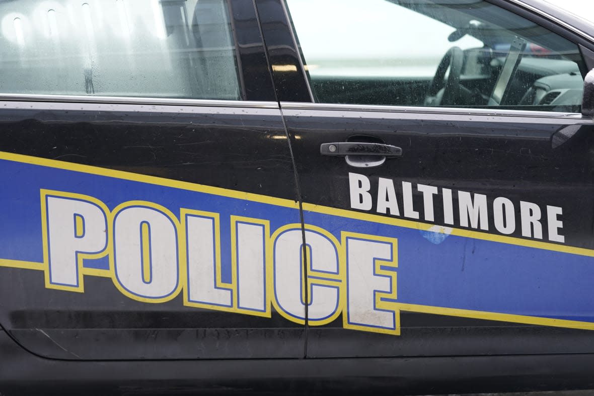 A Baltimore police cruiser is seen outside of a building as officers check on a call, Feb. 18, 2021, in Baltimore. (AP Photo/Julio Cortez, file)