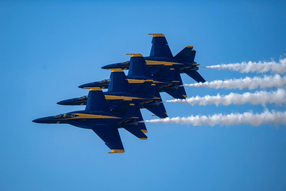 Piloting F/A-18 Super Hornets, the U.S. Navy Blue Angels flight demonstration squadron performs at the Northern Colorado Regional Airport on Saturday.