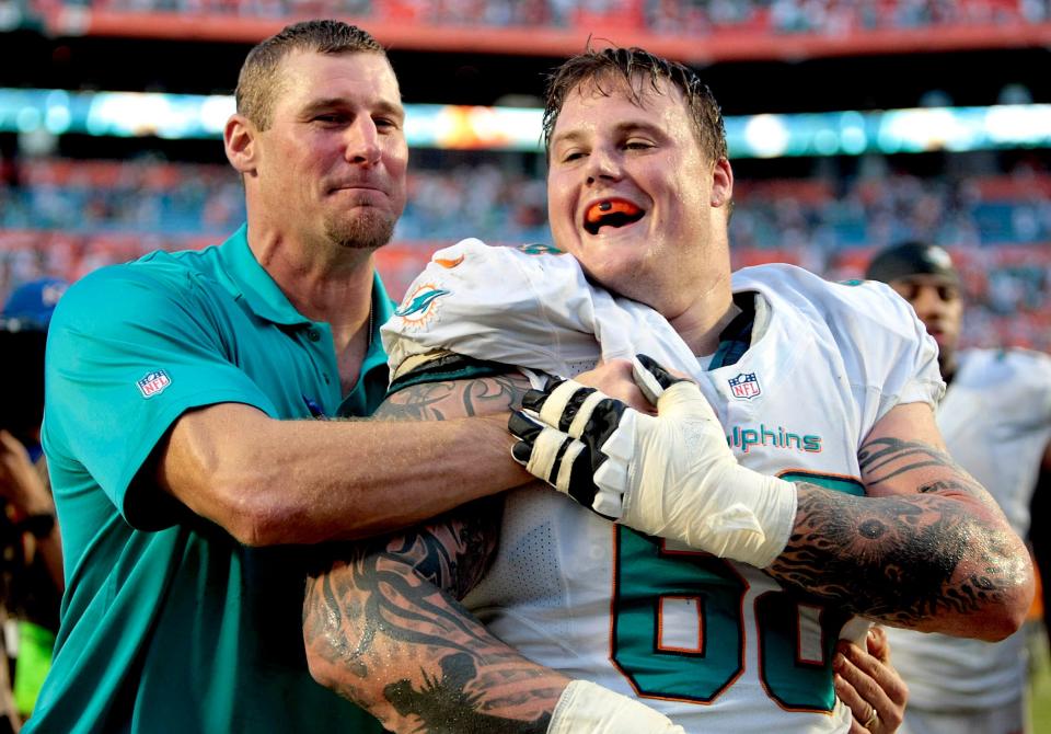 Miami Dolphins guard Richie Incognito (68), celebrates with tight ends coach Dan Campbell after defeating the Atlanta Falcons during their NFL game Sunday afternoon, Sept. 22, 2013. (Bill Ingram/Palm Beach Post)