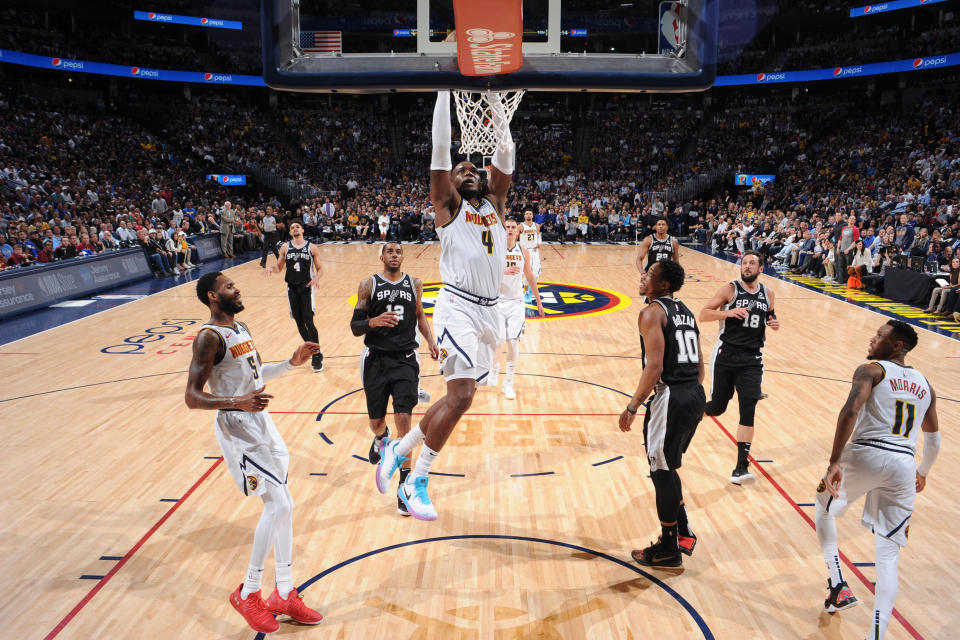 DENVER, CO - APRIL 16: Paul Millsap #4 of the Denver Nuggets dunks the ball against the San Antonio Spurs during Game Two of Round One of the 2019 NBA Playoffs on on April 16, 2019 at the Pepsi Center in Denver, Colorado. NOTE TO USER: User expressly acknowledges and agrees that, by downloading and/or using this Photograph, user is consenting to the terms and conditions of the Getty Images License Agreement. Mandatory Copyright Notice: Copyright 2019 NBAE (Photo by Bart Young/NBAE via Getty Images)