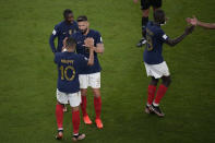 France's Kylian Mbappe celebrates after scoring his side's second goal with France's Olivier Giroud during the World Cup round of 16 soccer match between France and Poland, at the Al Thumama Stadium in Doha, Qatar, Sunday, Dec. 4, 2022. (AP Photo/Christophe Ena)