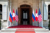 Flags of the U.S., Russia and Switzerland are pictured in front of the entrance of villa La Grange, one day prior to the meeting of U.S. President Joe Biden and Russian President Vladimir Putin in Geneva