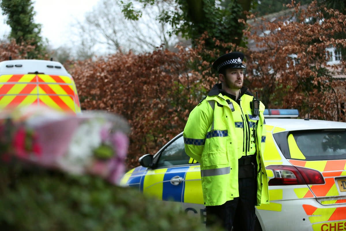 An officer near the scene at Linear Park in Culcheth, Warrington (William Lailey / SWNS)