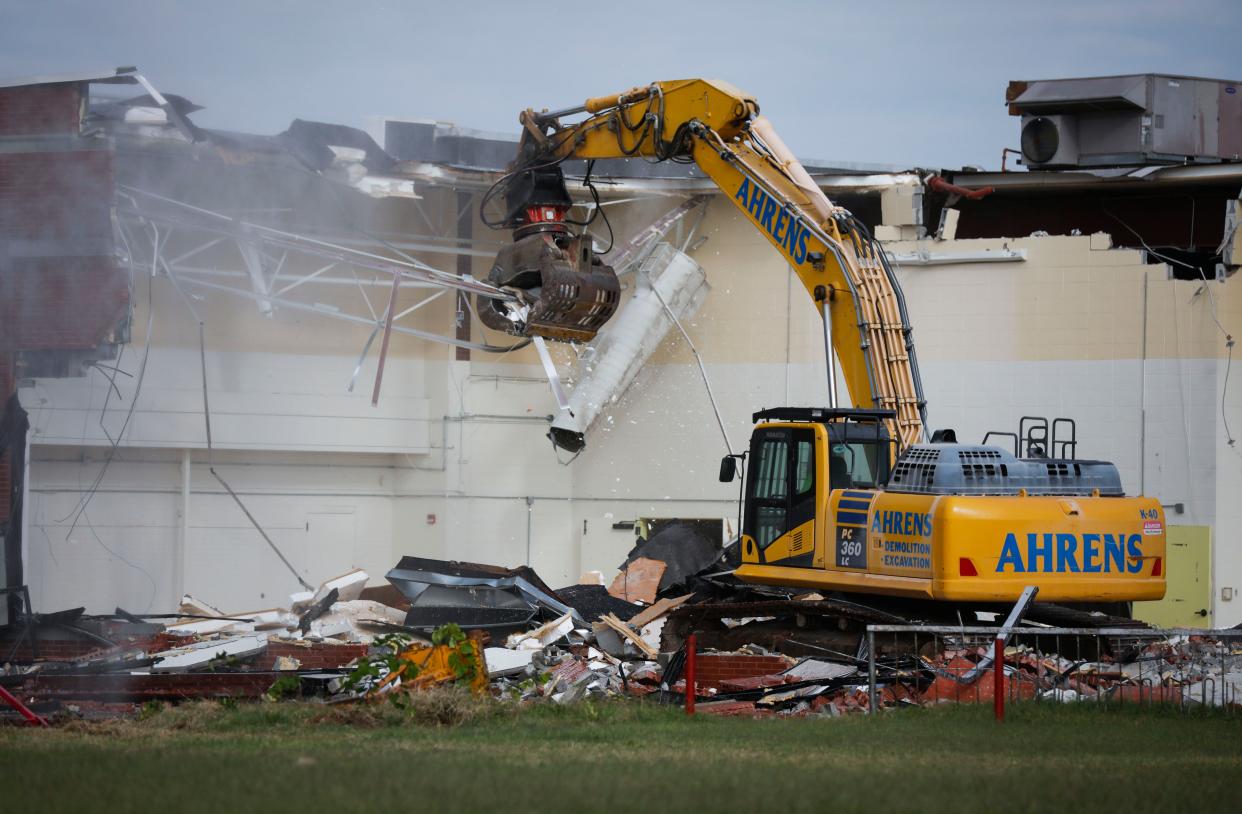 The old cafeteria and kitchen of Reed Academy was torn down Tuesday as part of a 60-day demolition. The new building will be constructed on the same campus.