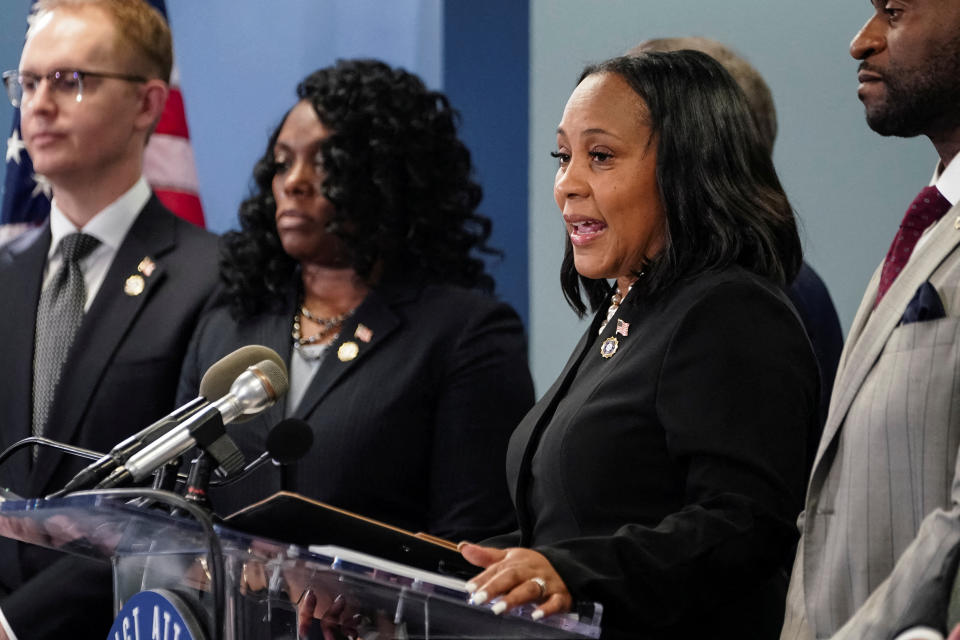 Fulton County, Georgia, District Attorney Fani Willis speaks at a podium.