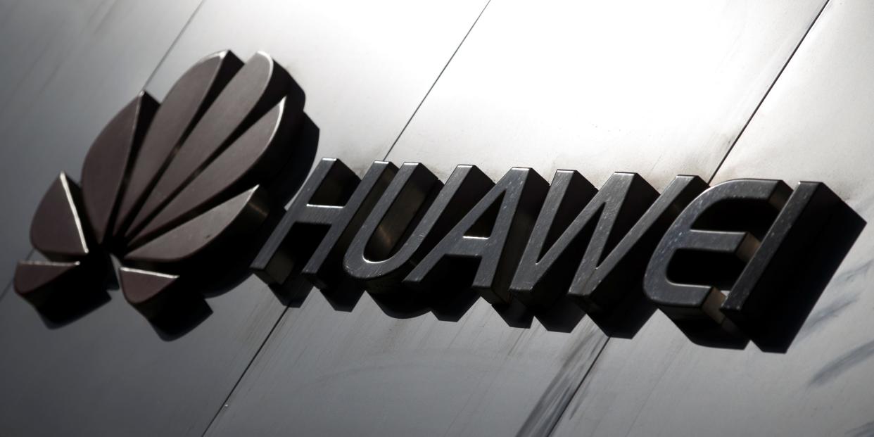The Huawei brand logo is seen above a store of the telecoms equipment maker in Beijing, China, March 7, 2019. REUTERS/Thomas Peter