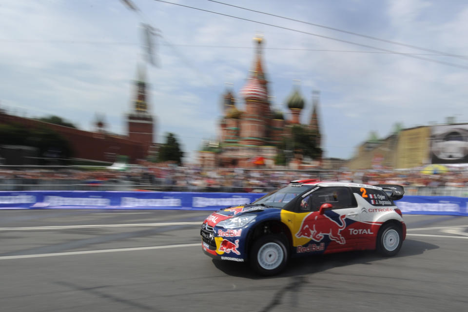 Citroen Total World Rally team pilot Sebastien Ogier of France drives past St. Basils cathedral during the "Moscow City Racing" show on July 17, 2011 in central Moscow. AFP PHOTO / NATALIA KOLESNIKOVA (Photo credit should read NATALIA KOLESNIKOVA/AFP/Getty Images)