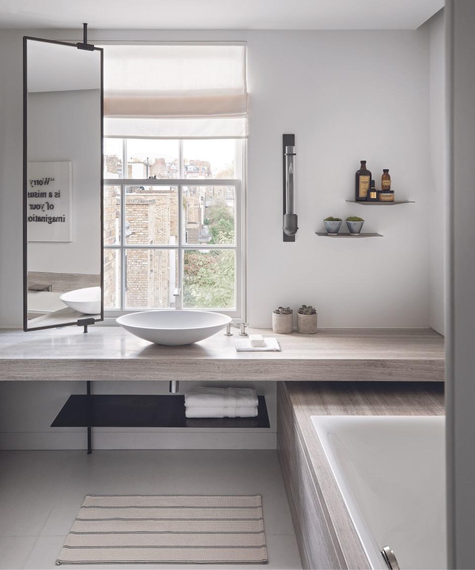 White walls, mirror, wooden counter