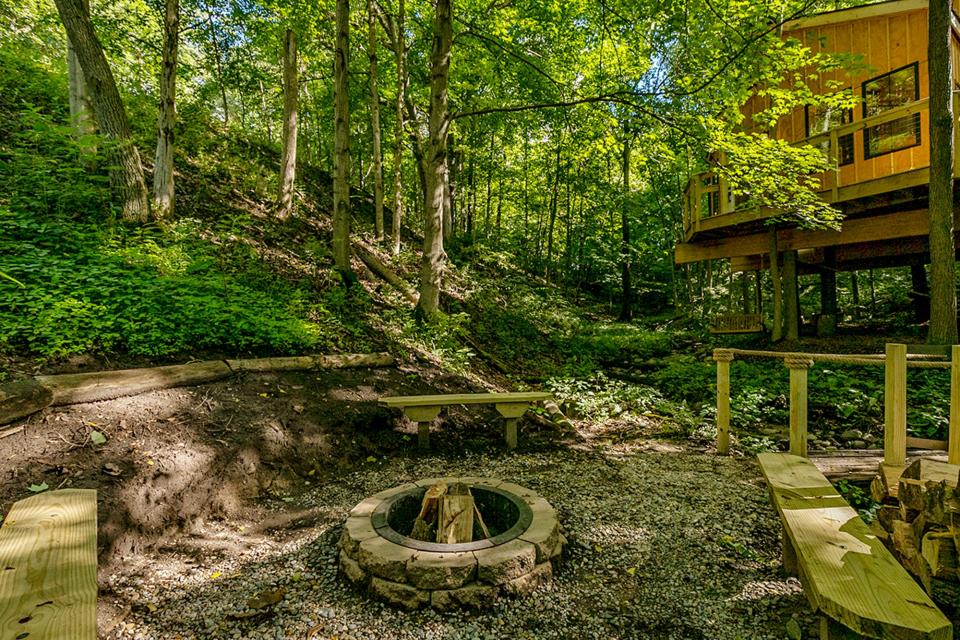 A bonfire pit is just steps away from the Winding Springs treehouse.