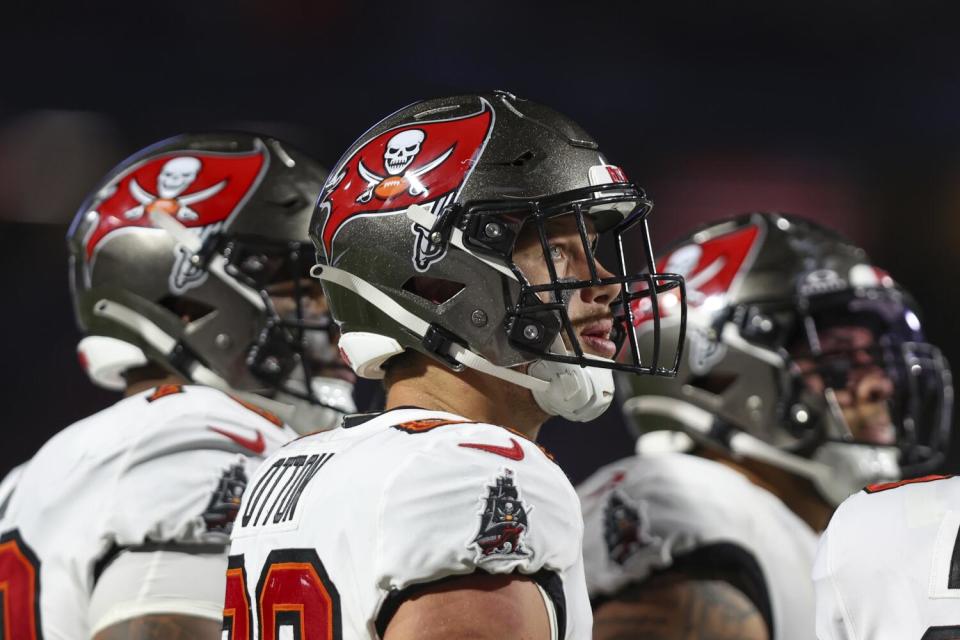 Tampa Bay Buccaneers tight end Cade Otton looks at the sideline from the field.