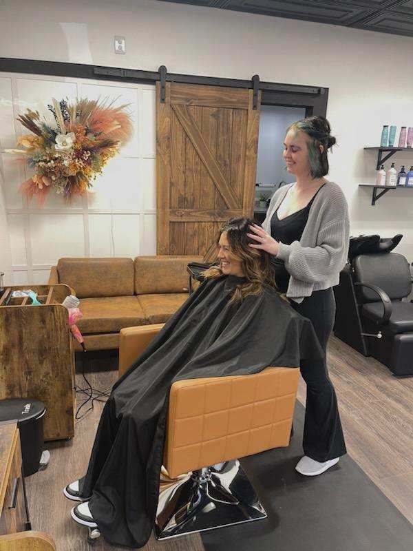 Allison Roberts works on a customer's hair in her Hello Gorgeous Salon.