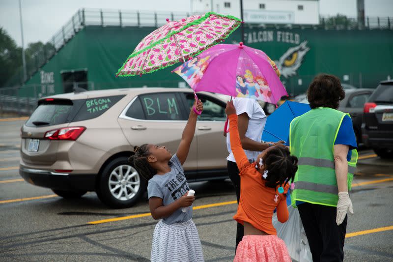 Students protest outside Groves High School in support of a fellow student who was jailed in a Detroit suburb