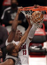 Miami Heat center Bam Adebayo (13) dunks over Brooklyn Nets forward Kevin Durant during the first half of an NBA basketball game Monday, Jan. 25, 2021, in New York. (AP Photo/Adam Hunger)