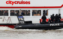 Armed counter terrorism officers of the London Metropolitan Police, take part in a training exercise to rescue hostages, played by actors, from a cruise boat on the river Thames, in London, Britain March 19, 2017. REUTERS/Peter Nicholls