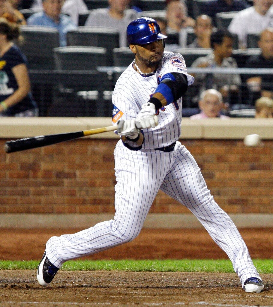 New York Mets' Gary Sheffield swings on a two-run double during the fourth inning of a baseball game against the Atlanta Braves on Tuesday, Aug. 18, 2009, in New York.