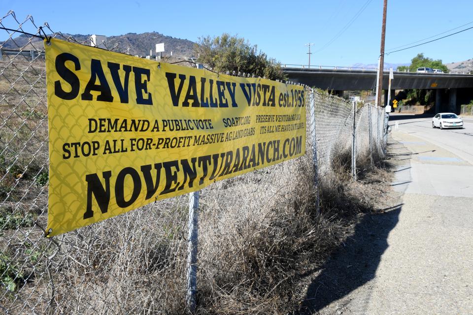One of several signs hangs near the entrance to Valley Vista neighborhood north of Ventura. A proposed farmworker housing development nearby has raised concerned from current residents.