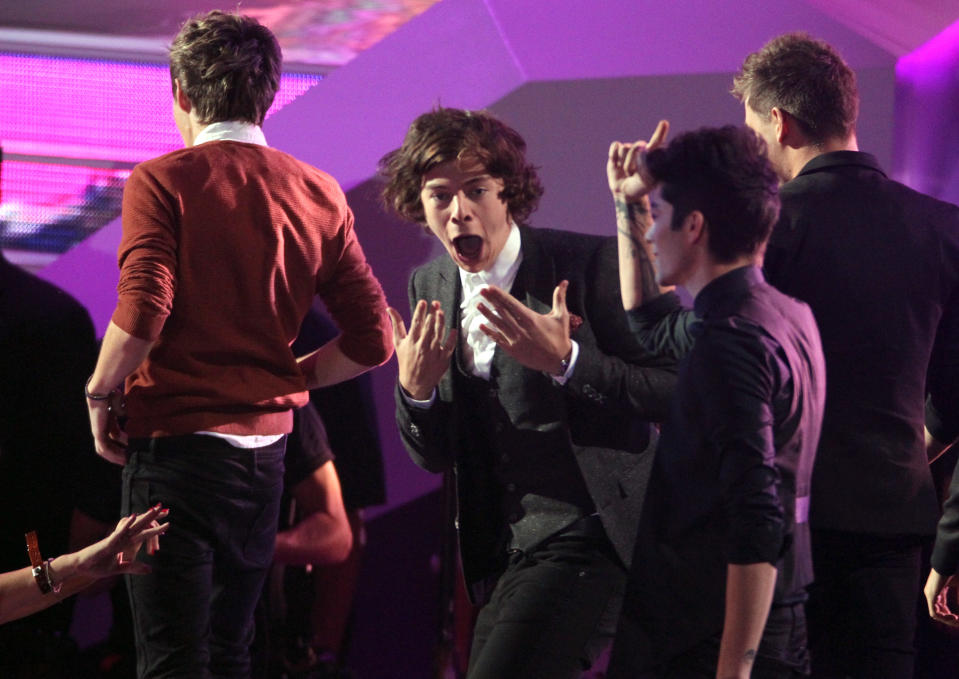 Harry Styles, of musical group One Direction, gestures as he wins the best pop video award for "What Makes You Beautiful" at the MTV Video Music Awards on Thursday, Sept. 6, 2012, in Los Angeles. (Photo by Matt Sayles/Invision/AP)