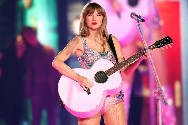 <p>John Shearer/Getty</p> Taylor Swift performing at the Eras Tour in August.
