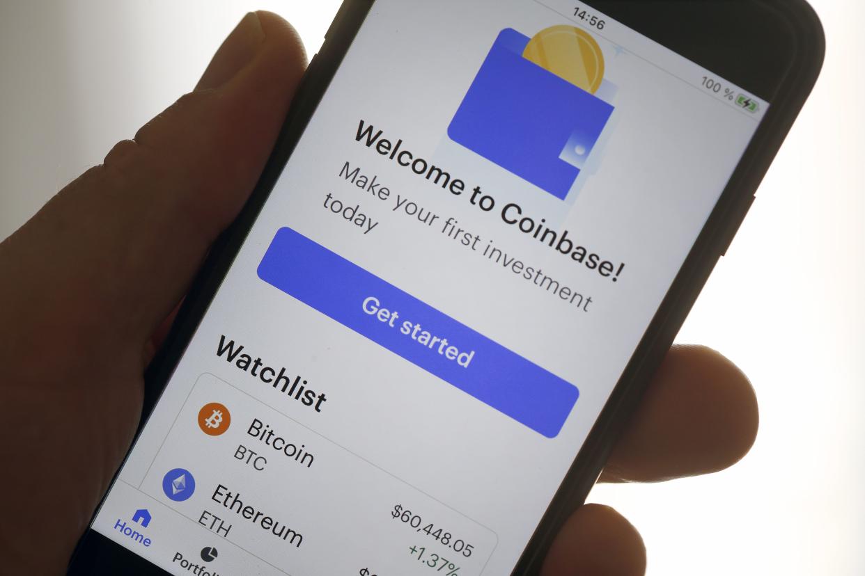 In this photo illustration, the home page of the application of the Coinbase cryptocurrency exchange platform is displayed on the screen of an iPhone on April 14, 2021 in Paris, France.