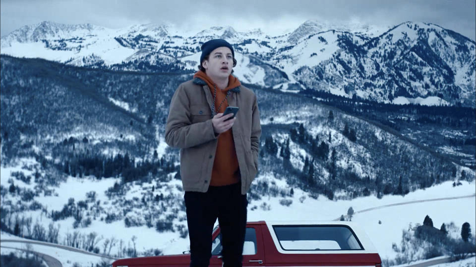 This image released by Quibi shows Tye Sheridan in a scene from "Wireless" which follows a college student navigating the snowy Colorado mountains. (Quibi via AP)