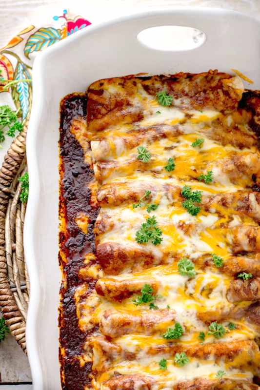 <p>Bunny's Warm Oven</p><p>Every layer of these delicious chicken enchiladas with homemade red enchilada sauce is packed with flavor!</p><p><strong>Get the recipe: <a href="https://bunnyswarmoven.net/chicken-enchiladas-with-homemade-red-enchilada-sauce/" rel="nofollow noopener" target="_blank" data-ylk="slk:Chicken Enchiladas with Homemade Red Enchilada Sauce;elm:context_link;itc:0;sec:content-canvas" class="link ">Chicken Enchiladas with Homemade Red Enchilada Sauce</a></strong></p>