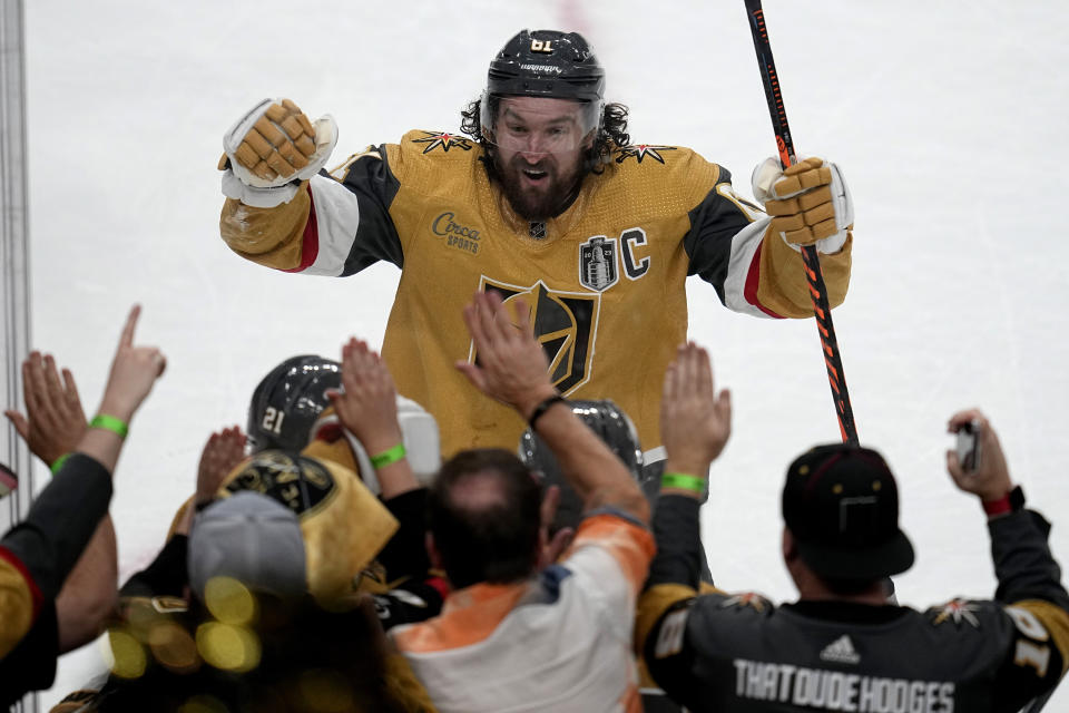 Vegas Golden Knights right wing Mark Stone celebrates with fans after a goal against the Florida Panthers during the second period of Game 1 of the NHL hockey Stanley Cup Finals, Saturday, June 3, 2023, in Las Vegas. (AP Photo/Abbie Parr)
