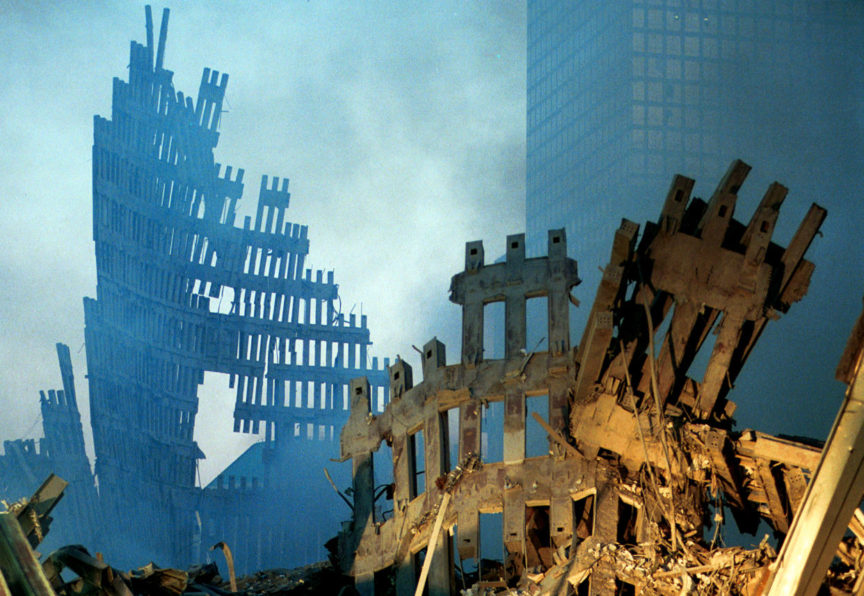 Image: Early morning light in the smoke and wreckage at the World Trade Center on Sept. 13, 2001. (Chris Hondros / Getty Images file)