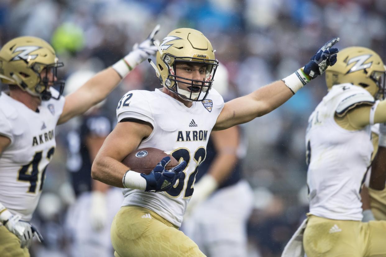 UNIVERSITY PARK, PA – SEPTEMBER 02: Zach Guiser #32 of the Akron Zips celebrates a interception in the end zone during the first quarter against the Penn State Nittany Lions on September 2, 2017 at Beaver Stadium in University Park, Pennsylvania. (Photo by Brett Carlsen/Getty Images)