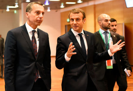 Austrian chancellor Christian Kern (L) and French President Emmanuel Macron arrive for a meeting at the Congress palace in Salzburg, Austria, August 23, 2017. REUTERS/Bertrand Guay