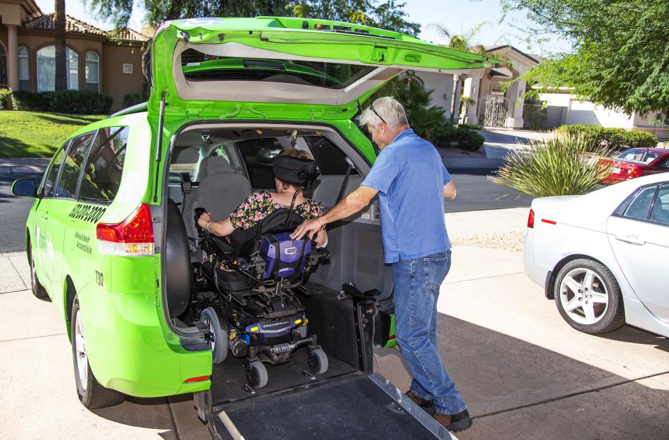 A Scottsdale customer enters a RideChoice van in 2019.