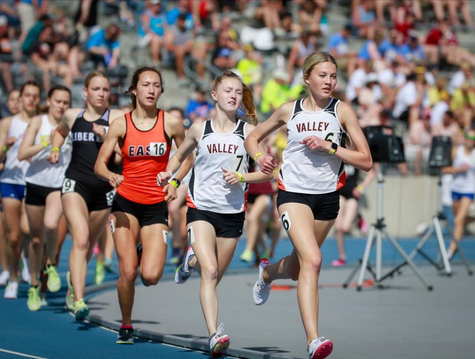 West Des Moines Valley's Addison Dorenkamp, right, and Kamryn Ensley lead the field in the Class 4A 3,000-meter run at the state high school track and field meet at Drake Stadium on Thursday.