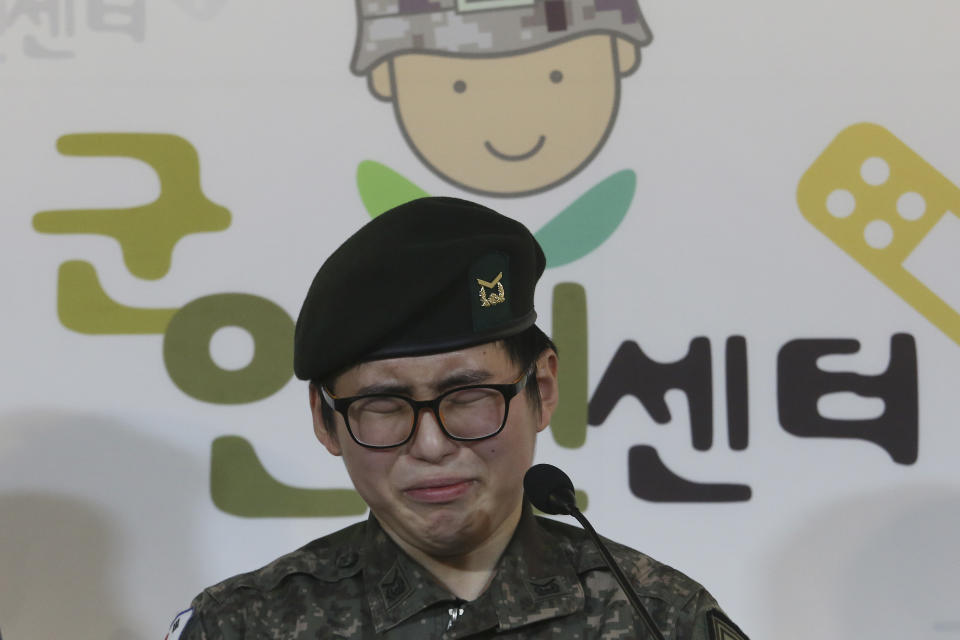 South Korean army Sergeant Byun Hui-su weeps during a press conference at the Center for Military Human Right Korea in Seoul, South Korea, Wednesday, Jan. 22, 2020. South Korea's military decided Wednesday to discharge Byun who recently undertook gender reassignment surgery, a ruling expected to draw strong criticism from human rights groups.The sign reads "The Center for Military Human Right Korea." (AP Photo/Ahn Young-joon)